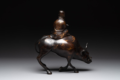 A Japanese gold-splashed bronze incense burner in the shape of an immortal riding a buffalo, ​​Kin San Sō On 金産宗音製造 mark, Meiji, 19th C.