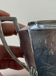 A Chinese silver covered teapot, sugar jar and milk jug with bamboo design, Tackhing 90% silver mark, 20th C.