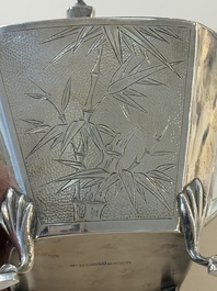 A Chinese silver covered teapot, sugar jar and milk jug with bamboo design, Tackhing 90% silver mark, 20th C.