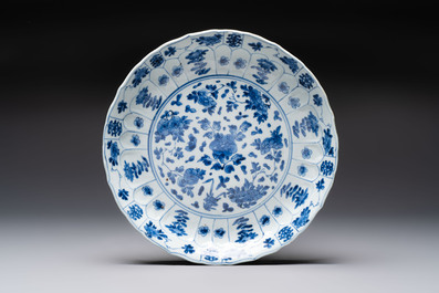 Seven Chinese blue and white plates with floral design, Kangxi