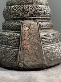 A Cambodian silver repouss&eacute; Buddha with inscription, 19th C.