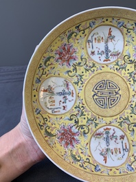 A Chinese famille rose yellow-ground 'Antiquities' plate, Guangxu mark, 19/20th C.