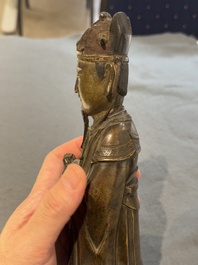 A Chinese bronze figure of an official, Ming