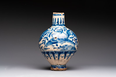A blue and white Portugese faience jug with a bird among flowering branches, 17th C.