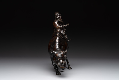 A Japanese gold-splashed bronze incense burner in the shape of an immortal riding a buffalo, ​​Kin San Sō On 金産宗音製造 mark, Meiji, 19th C.