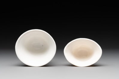 Two Chinese Dehua blanc de Chine wine cups and a figure of Liuhai, 18/19th C.