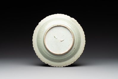 A Chinese blue and white 'phoenix' dish and two 'Buddhist lion' and 'peony' plates, Hongzhi/Zhengde