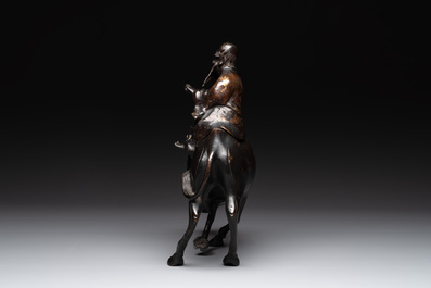 A Japanese gold-splashed bronze incense burner in the shape of an immortal riding a buffalo, ​​Kin San Sō On 金産宗音製造 mark, Meiji, 19th C.