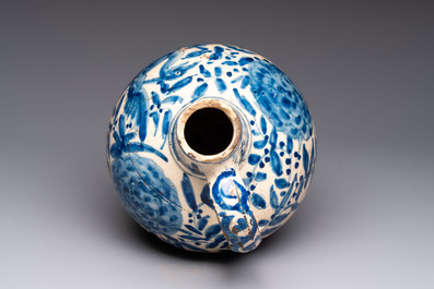 A blue and white Portugese faience jug with a bird among flowering branches, 17th C.