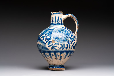 A blue and white Portugese faience jug with a bird among flowering branches, 17th C.