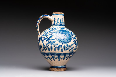 A blue and white Portugese faience jug with a bird among flowering branches, 17th C.