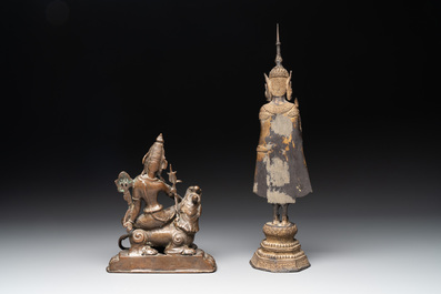 A bronze Simhanada Lokeshvara seated on a Buddhist lion and a Buddha, Southeast Asia, 19th C.