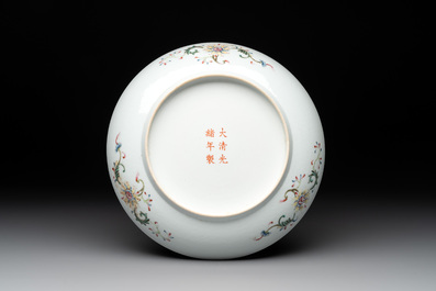 A Chinese famille rose yellow-ground 'Antiquities' plate, Guangxu mark, 19/20th C.