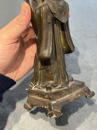 A Chinese bronze figure of an official, Ming