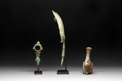 Three palanquin hooks, a bronze sculpture of naga Mucalinda and an elephant-form kendi, Cambodia, 13th C. and earlier
