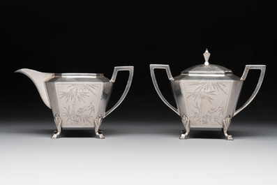 A Chinese silver covered teapot, sugar jar and milk jug with bamboo design, Tackhing 90% silver mark, 20th C.