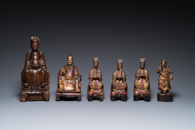 Six various Chinese gilt-lacquered carved wooden sculptures of dignitaries and a guard, Ming and later