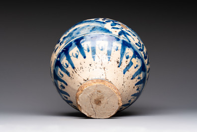 A blue and white Portugese faience jug with a bird among flowering branches, 17th C.