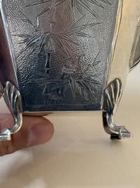 A Chinese silver covered teapot, sugar jar and milk jug with bamboo design, Tackhing 90% silver mark, 20th C.