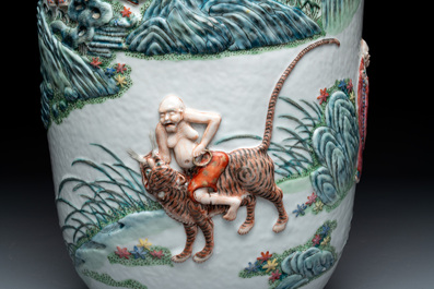 A pair of Chinese famille rose '18 Luohan' vases with relief design, 19th C.