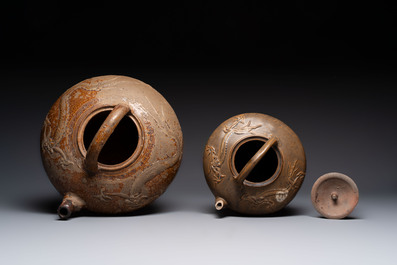Two brown-glazed 'dragon' ewers with relief design, Qing