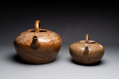 Two brown-glazed 'dragon' ewers with relief design, Qing