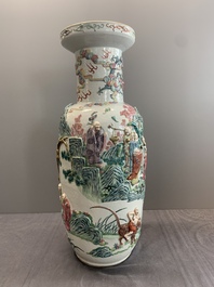 A pair of Chinese famille rose '18 Luohan' vases with relief design, 19th C.