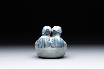 A Chinese blue and white 'double mandarin duck' ewer or water dropper on wooden stand, Ming, ca. 1500