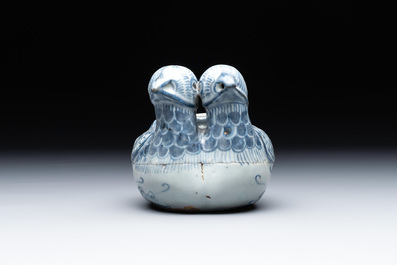 A Chinese blue and white 'double mandarin duck' ewer or water dropper on wooden stand, Ming, ca. 1500