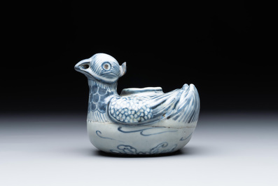 A Chinese blue and white 'double mandarin duck' ewer or water dropper on wooden stand, Ming, ca. 1500