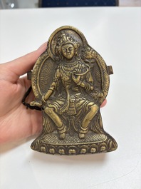 A Tibetan copper Gawu box and tsa tsa mold, 19th C.