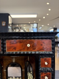 A small tortoiseshell-veneered cabinet of drawers with mirrored interior, Antwerp, 17th C.