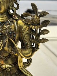 A fine Sino-Tibetan turquoise- and coral-inlaid gilt-bronze Buddha Maitreya, Kangxi