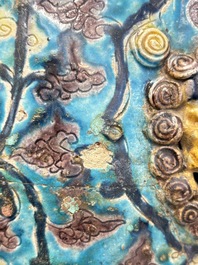A Chinese Fahua barrel-shaped 'lotus scroll' stool with incised design, Ming