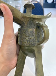 A Chinese archaic bronze wine vessel, 'jue 爵', late Shang