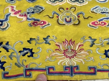 An imperial Chinese embroidered silk gold-thread yellow-ground cushion cover, Qianlong/Jiaqing