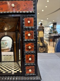 A small tortoiseshell-veneered cabinet of drawers with mirrored interior, Antwerp, 17th C.