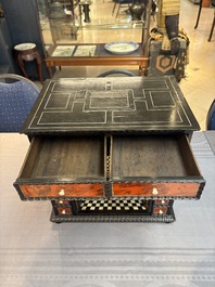 A small tortoiseshell-veneered cabinet of drawers with mirrored interior, Antwerp, 17th C.
