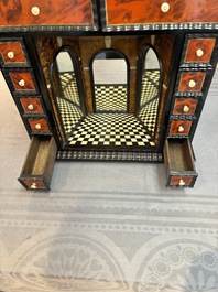 A small tortoiseshell-veneered cabinet of drawers with mirrored interior, Antwerp, 17th C.