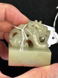 A Chinese celadon and russet jade 'dragon' seal, 18/19th C.