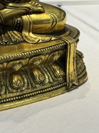 A fine Sino-Tibetan turquoise- and coral-inlaid gilt-bronze Buddha Maitreya, Kangxi