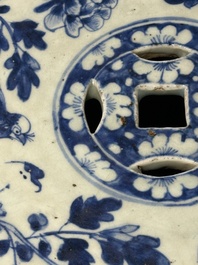 A Chinese blue and white 'birds among flowering branches' garden seat, 19th C.