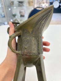 A Chinese archaic bronze wine vessel, 'jue 爵', late Shang