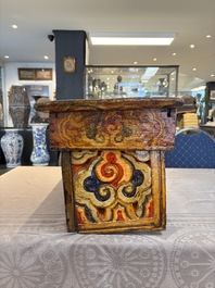 Two Tibetan polychromed wooden folding tables with dragon design, 19/20th C.