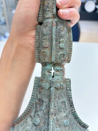 A Chinese archaic bronze wine vessel with 'taotie' design, 'gu 觚', Shang