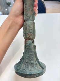 A Chinese archaic bronze wine vessel with 'taotie' design, 'gu 觚', Shang