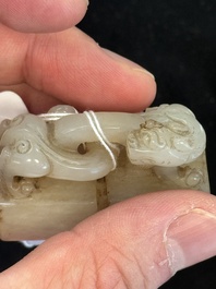 A Chinese celadon and russet jade 'chilong' seal, 18/19th C.