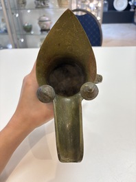 A Chinese archaic bronze wine vessel, 'jue 爵', late Shang