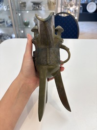 A Chinese archaic bronze wine vessel, 'jue 爵', late Shang
