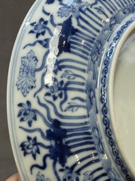 A Chinese blue and white 'lotus pond' plate, Qianlong mark, 19/20th C.
